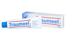 Traumeel's heel cream 100g tube with a blue cap shown in front of its white and blue packaging box on a plain white background.